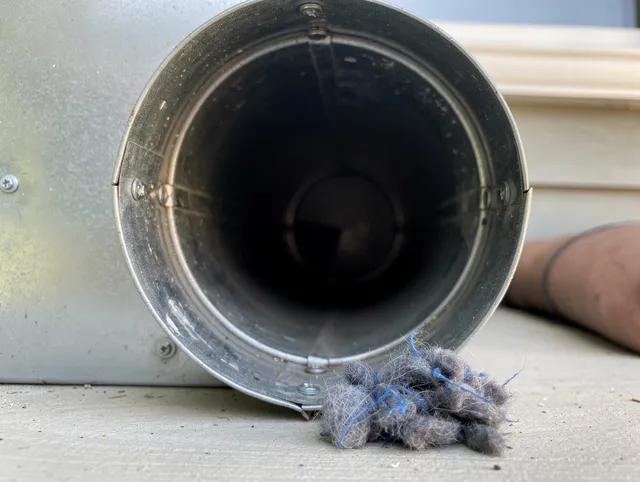 Laguna Beach Dryer Vent Cleaning technician using specialized equipment to clear severe dryer vent blockage in Laguna Beach